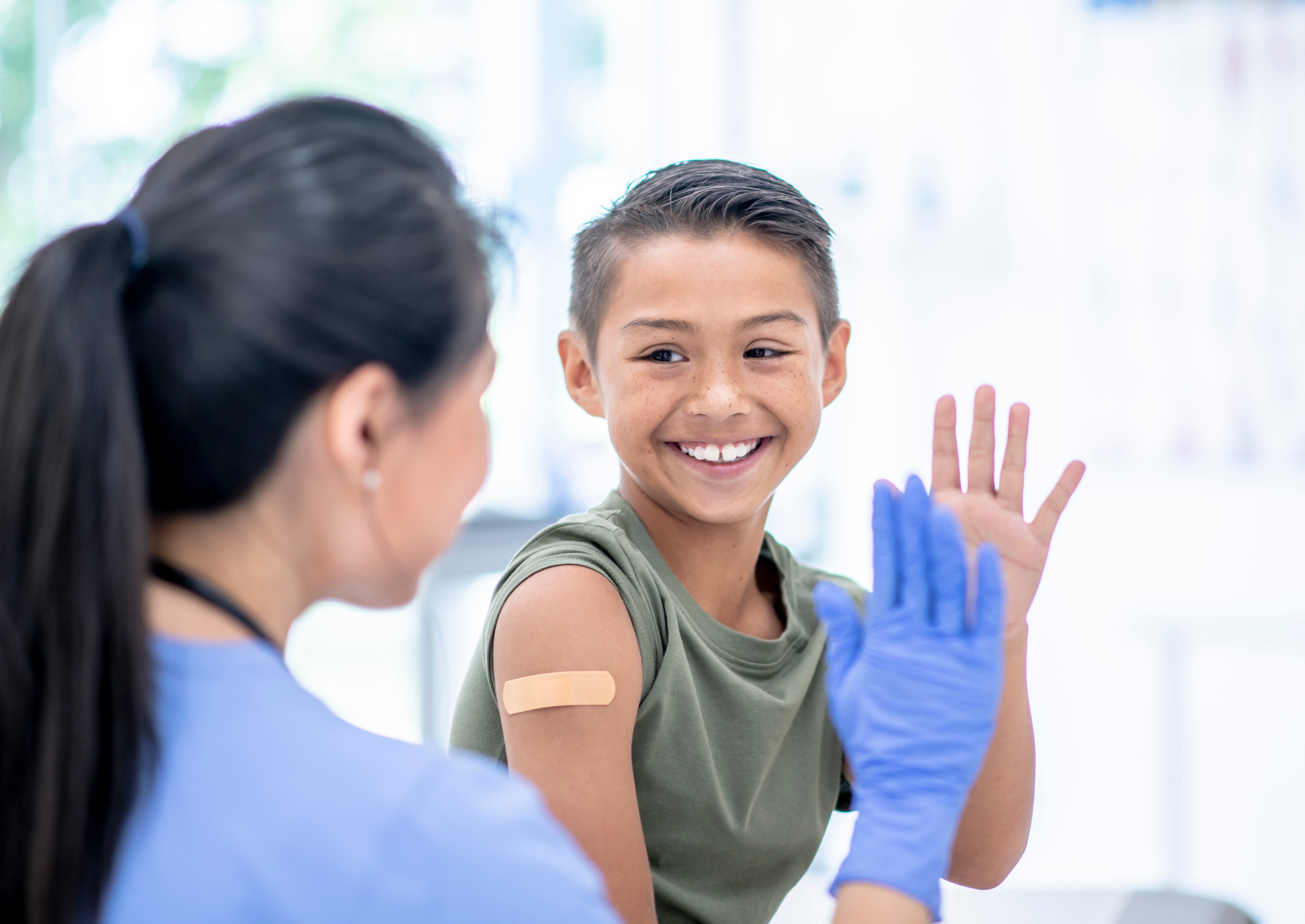 Per diem nurse giving a child a flu vaccine Per diem nurse giving a child a flu vaccine