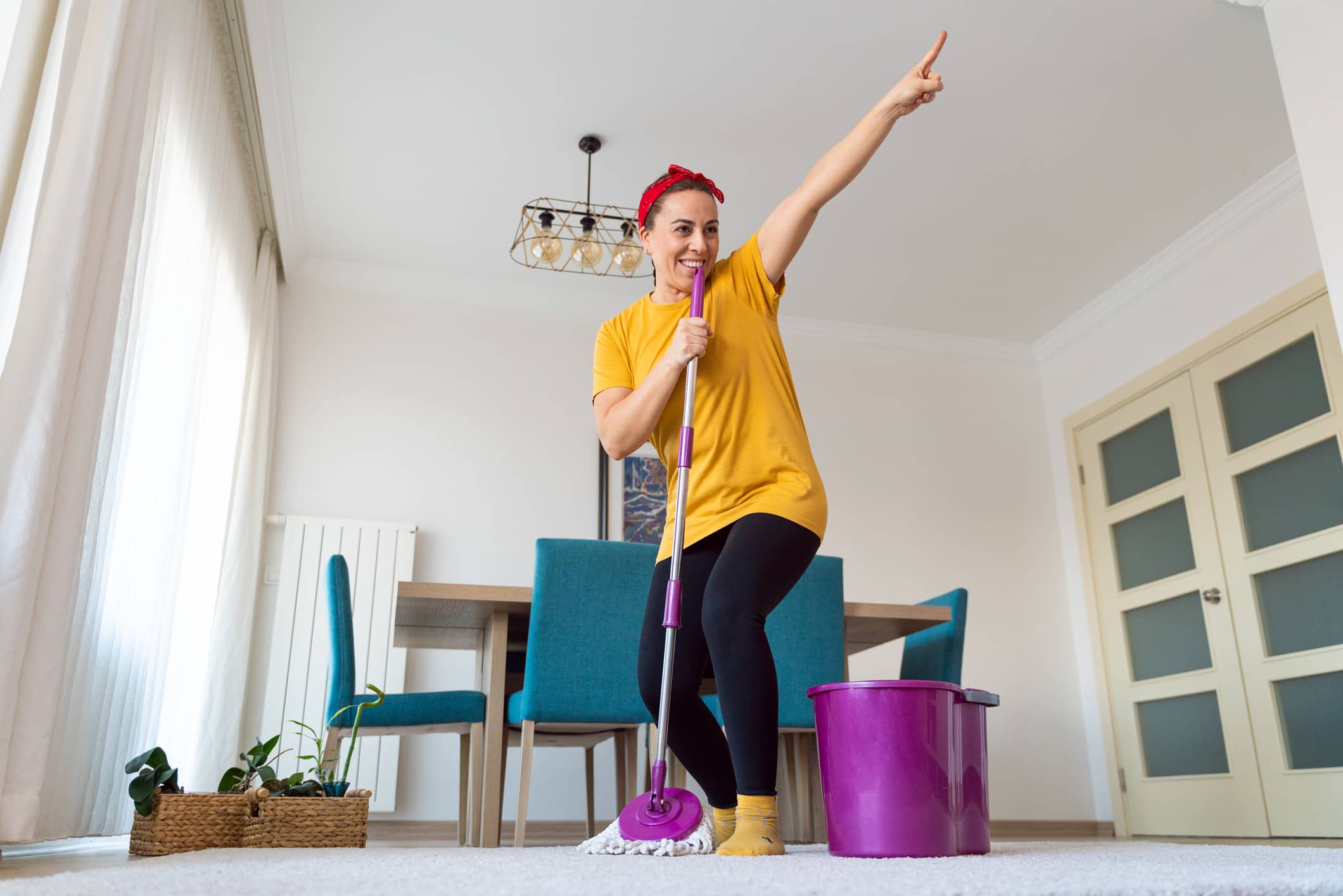 Nurse enjoying spring cleaning in her home Nurse enjoying spring cleaning in her home