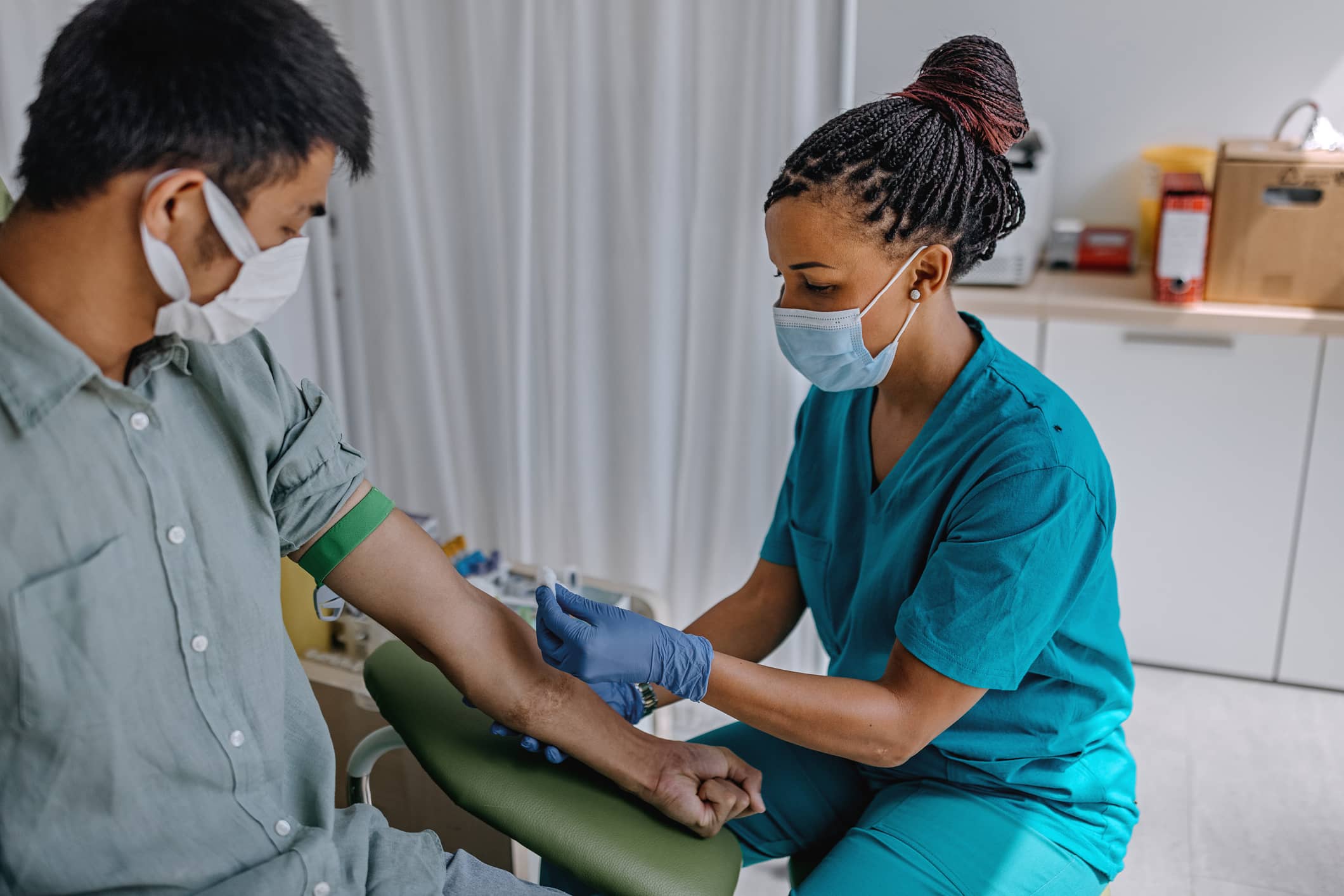 Per diem nurse taking a patient's blood Per diem nurse taking a patient's blood